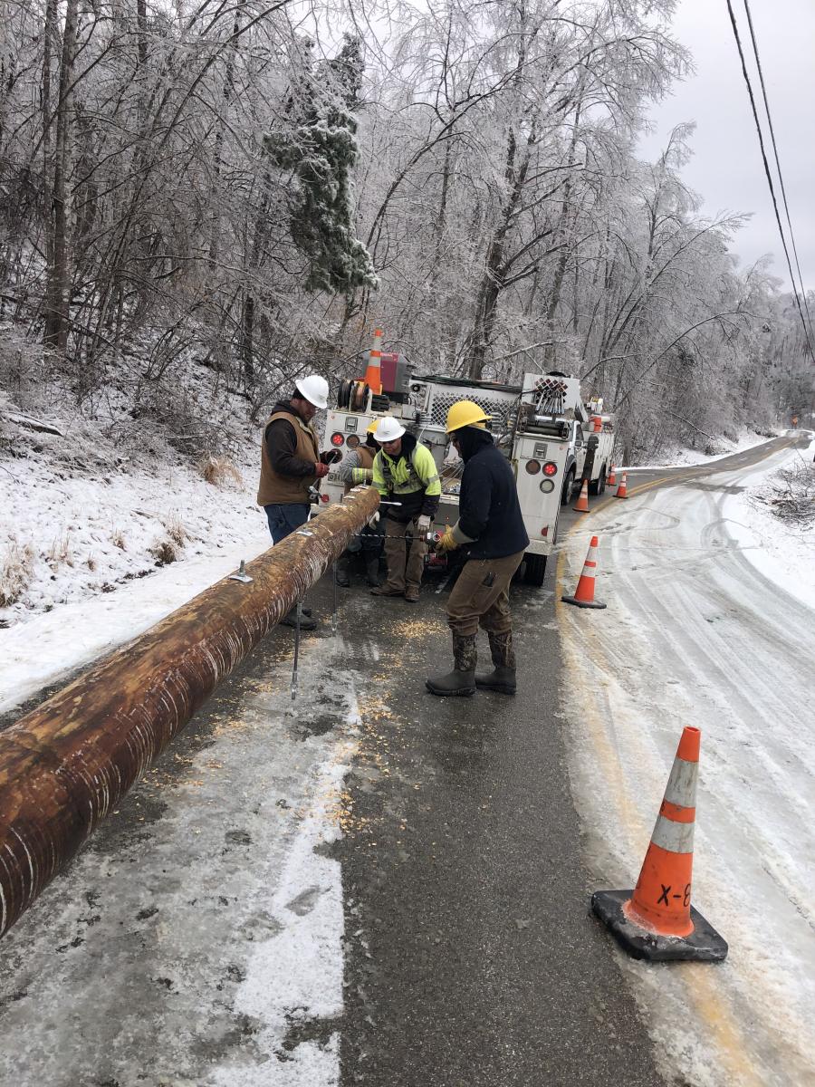 Lineworkers working in snow