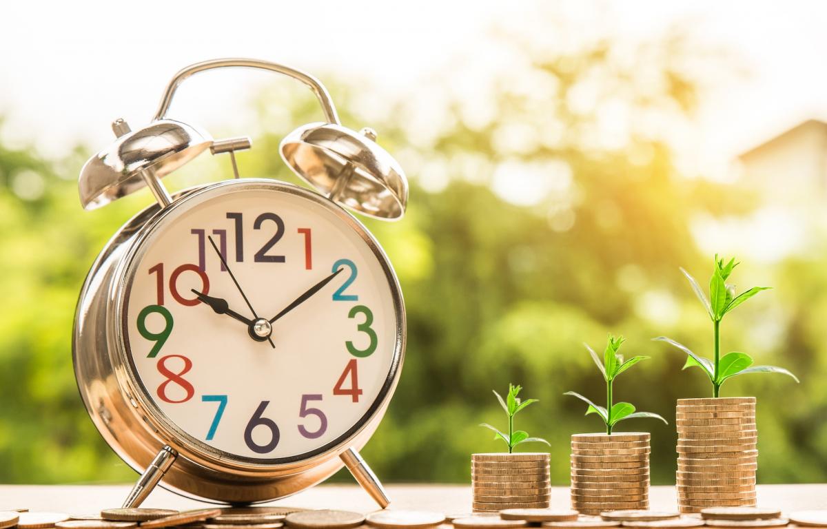 Clock and stacks of coins