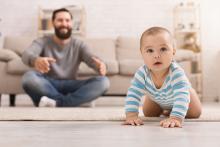 Baby crawling on floor